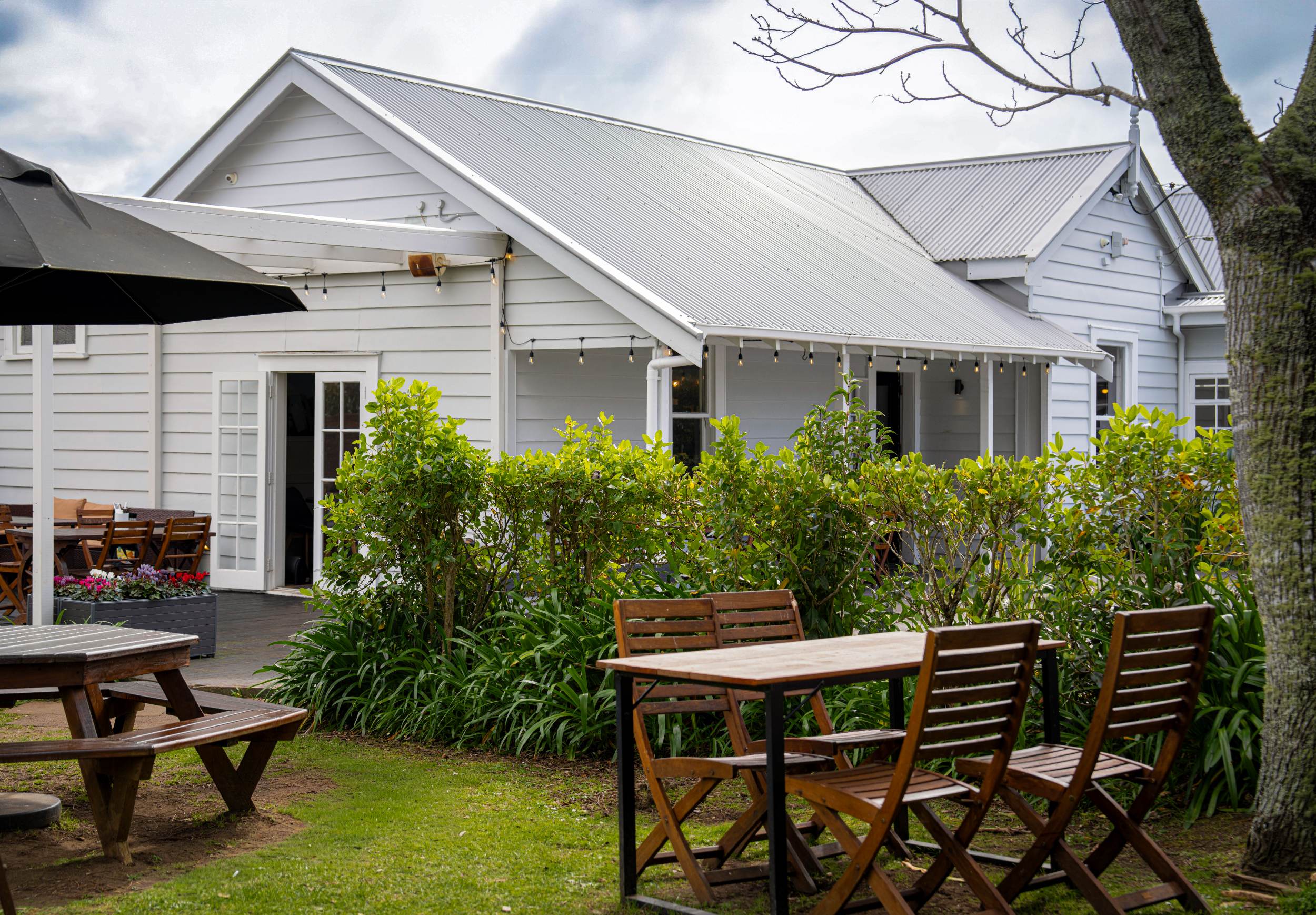 The villa exterior of The Collins Cafe & Bar